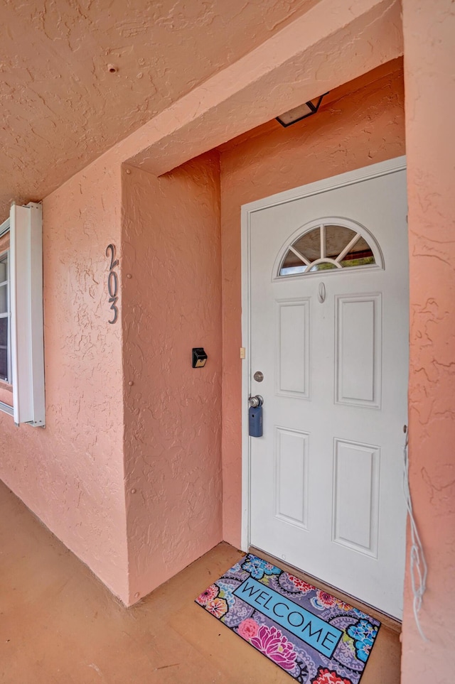 1260 NW 20th Ave Unit 203, Delray Beach, FL 33445 - property entrance featuring stucco siding