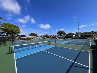 1260 NW 20th Ave Unit 203, Delray Beach, FL 33445 - view of tennis court with fence and community basketball court