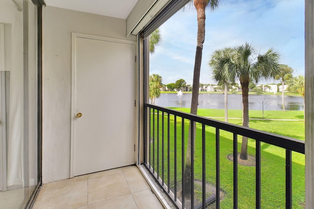 unfurnished sunroom with a water view