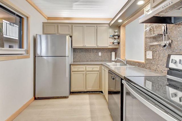 kitchen featuring cream cabinets, sink, range hood, tasteful backsplash, and stainless steel appliances