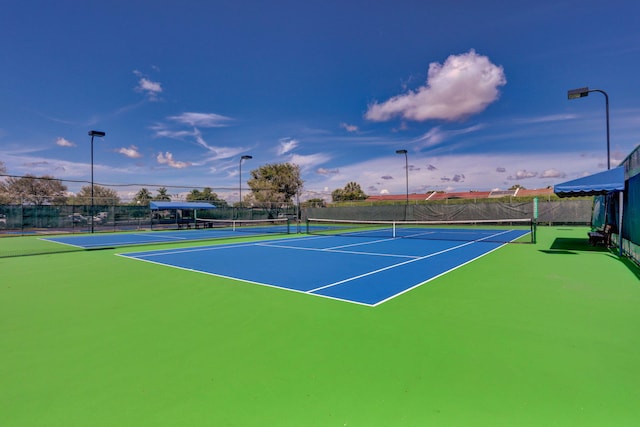 view of sport court with basketball hoop