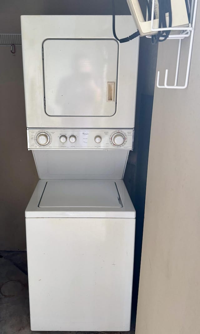 laundry area featuring stacked washer / dryer