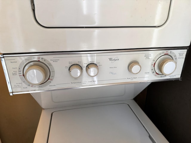 room details featuring stacked washer / drying machine