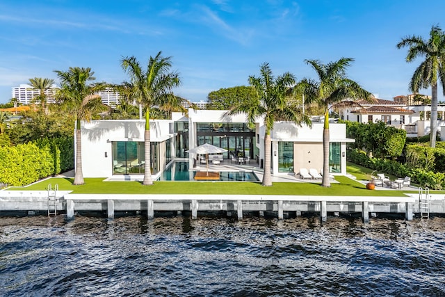 view of dock featuring a water view and a lawn