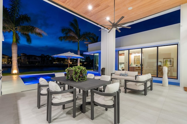 view of patio / terrace featuring ceiling fan