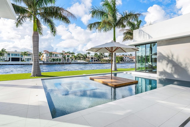 view of pool with a water view