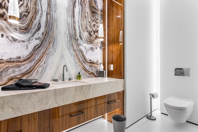 bathroom featuring toilet and vanity