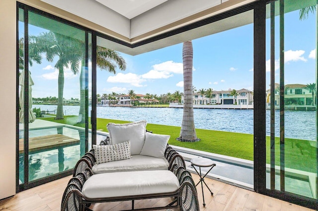 sunroom with a water view