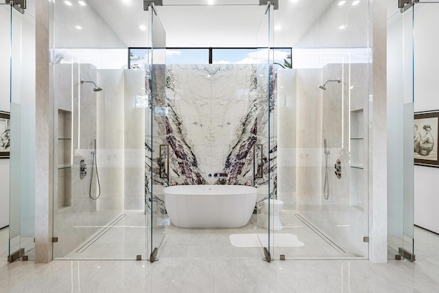 bathroom featuring shower with separate bathtub