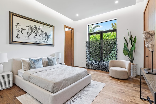 bedroom with light hardwood / wood-style flooring