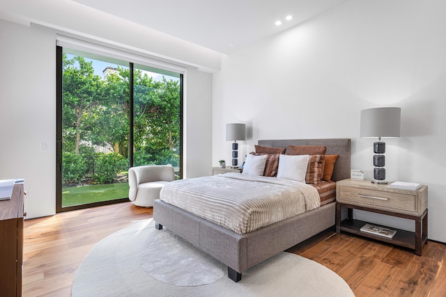 bedroom with hardwood / wood-style floors