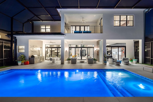 rear view of house featuring a patio area, ceiling fan, and an outdoor hangout area