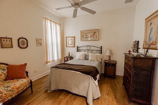 bedroom featuring hardwood / wood-style floors and ceiling fan