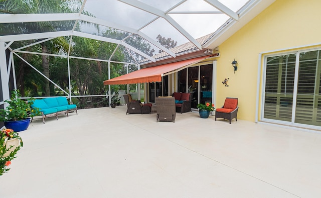 view of patio with an outdoor living space and glass enclosure