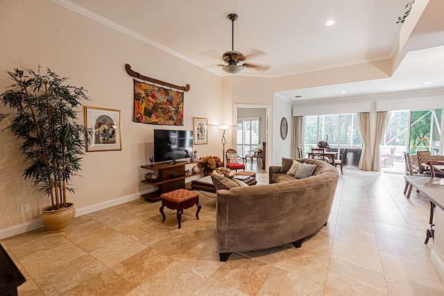 living room with ornamental molding and ceiling fan