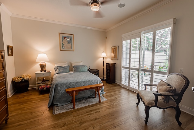 bedroom with ornamental molding, dark wood-type flooring, access to outside, and ceiling fan