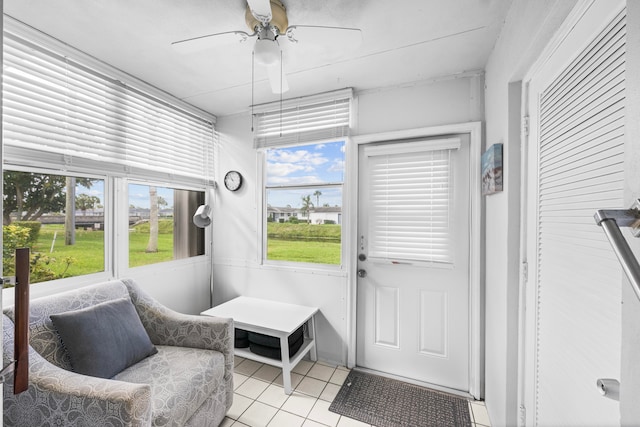 sunroom / solarium with ceiling fan