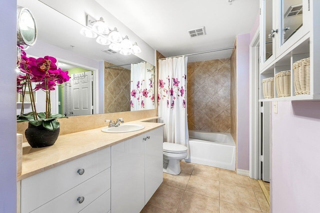 full bathroom featuring shower / bath combo, tile patterned flooring, vanity, and toilet