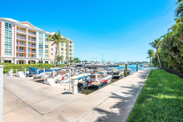 exterior space featuring a dock and a water view