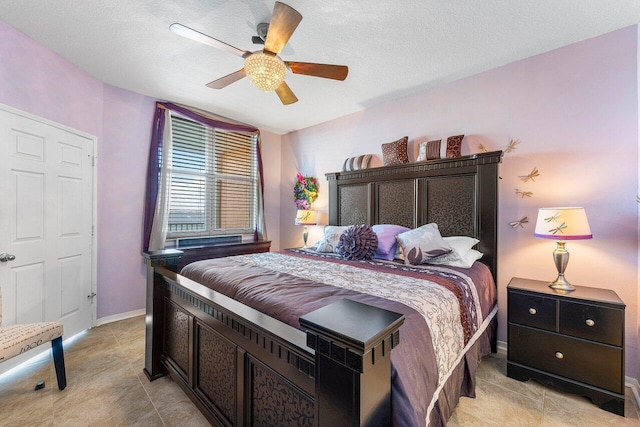 bedroom featuring a textured ceiling and ceiling fan