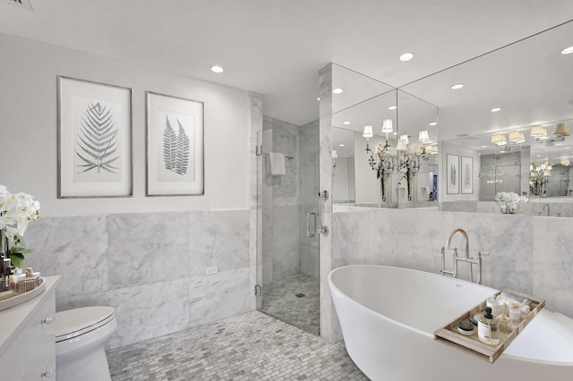 full bathroom featuring tile patterned floors, independent shower and bath, tile walls, and toilet