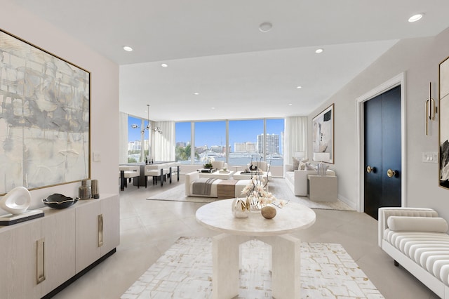 living room featuring a chandelier and floor to ceiling windows