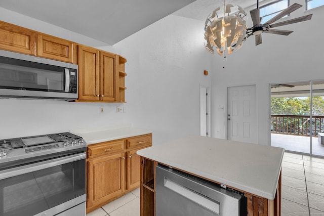 kitchen featuring brown cabinets, open shelves, stainless steel appliances, light countertops, and light tile patterned flooring