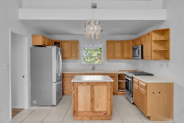 kitchen featuring a center island, open shelves, light countertops, appliances with stainless steel finishes, and a sink