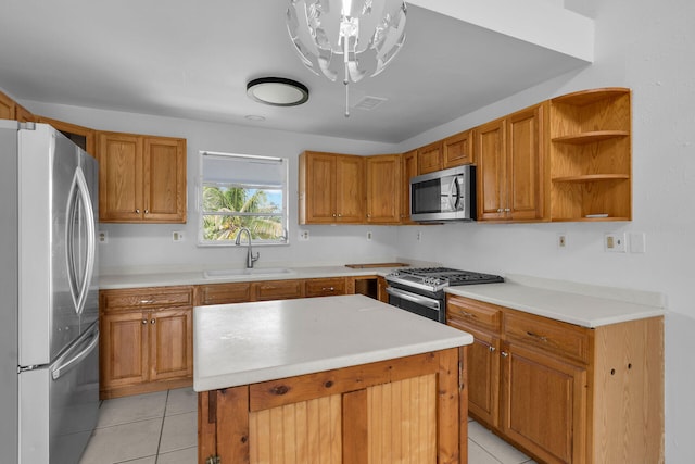 kitchen featuring a kitchen island, a sink, light countertops, appliances with stainless steel finishes, and open shelves