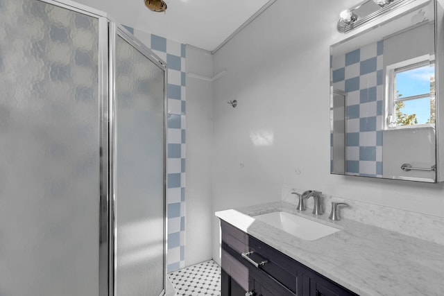 bathroom featuring vanity, a shower stall, and tile patterned floors