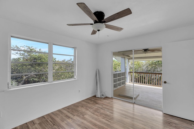 unfurnished room featuring ceiling fan and wood finished floors