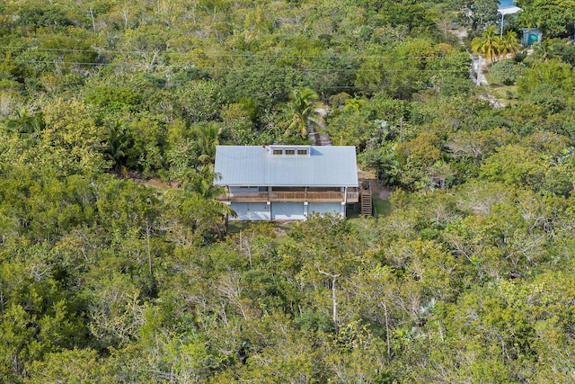 aerial view featuring a wooded view