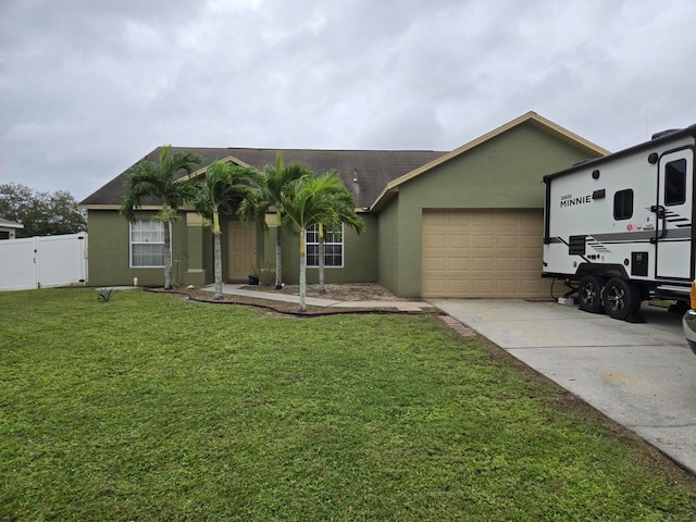 ranch-style house featuring a front lawn and a garage