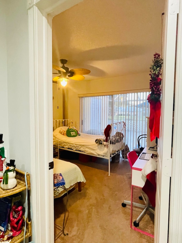 carpeted bedroom with ceiling fan