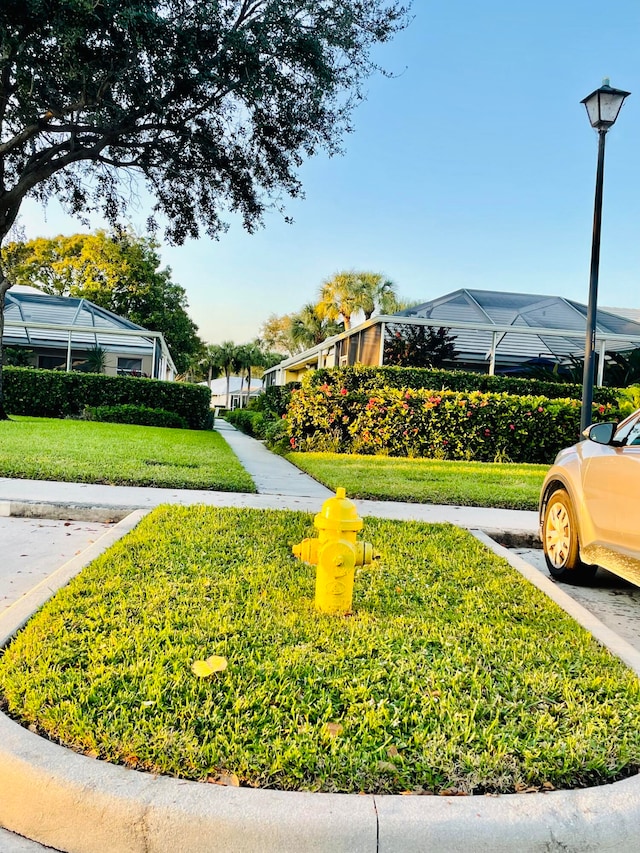 view of home's community featuring a lawn