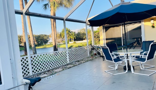 view of patio with a water view