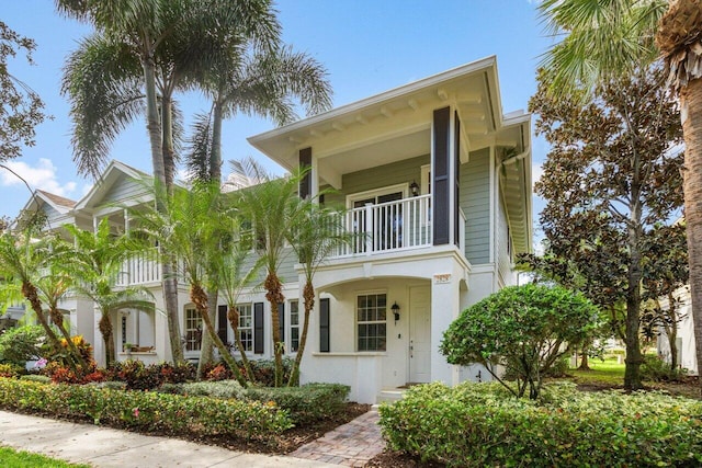 view of front of house featuring a balcony