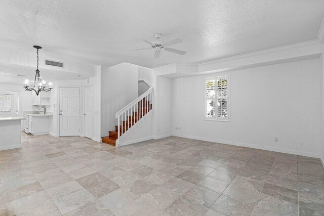 unfurnished living room featuring a textured ceiling, ceiling fan with notable chandelier, crown molding, and sink