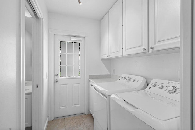 laundry area with cabinet space and washing machine and dryer