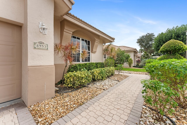 view of side of property with a garage