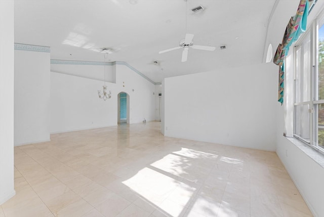 unfurnished room with ceiling fan and vaulted ceiling