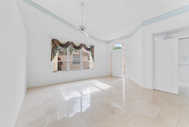 empty room featuring ornamental molding and ceiling fan