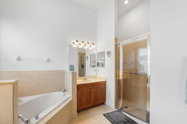 bathroom with vanity, tile patterned floors, and independent shower and bath