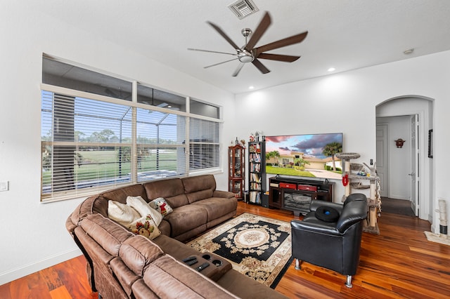 living room with ceiling fan and hardwood / wood-style flooring