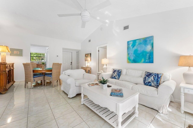 tiled living room featuring ceiling fan and lofted ceiling