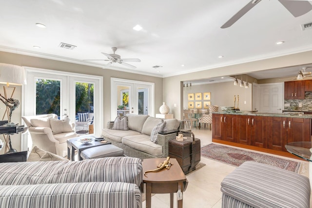 living room with french doors, light tile patterned floors, ceiling fan, and crown molding