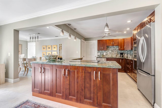 kitchen with stainless steel appliances, light stone counters, decorative light fixtures, decorative backsplash, and light tile patterned flooring