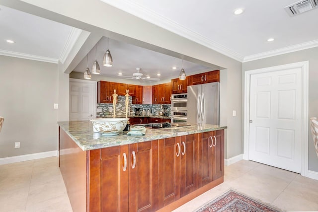 kitchen with tasteful backsplash, light stone countertops, pendant lighting, and stainless steel appliances