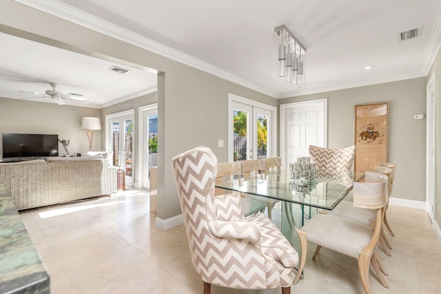 dining area featuring french doors, ornamental molding, and light tile patterned flooring