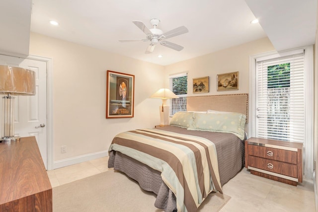 bedroom with ceiling fan and light tile patterned flooring